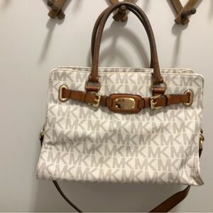 .  It has missing a toggle on a zipper pull. And the handles have average worn.